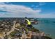 Coastal condo situated by the water in a city environment near a pier and residential buildings at 500 N Osceola Ave # 609, Clearwater, FL 33755