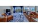Comfortable living room featuring plush seating, a stylish rug, and a large TV for entertainment at 500 N Osceola Ave # 609, Clearwater, FL 33755