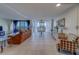 Bright living room with sliding glass doors to the water, a comfortable sofa, and a view of the dining area at 500 N Osceola Ave # 609, Clearwater, FL 33755