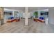 Open-air lobby with neutral colored seating and tiled flooring at 500 N Osceola Ave # 609, Clearwater, FL 33755