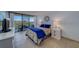 Serene main bedroom featuring a comfortable bed, balcony access, and ample natural light at 500 N Osceola Ave # 609, Clearwater, FL 33755