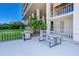 Outdoor patio area with a grill, table and seating with lush green lawn at 500 N Osceola Ave # 609, Clearwater, FL 33755