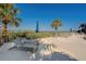 Pool deck with lounge chairs, umbrellas and clear views of the waterfront and trees at 500 N Osceola Ave # 609, Clearwater, FL 33755