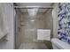 Tiled shower with a glass door, providing a clean and modern look in the bathroom at 500 N Osceola Ave # 609, Clearwater, FL 33755