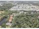 This aerial view shows easy access to highways and shopping, and a neighborhood with a community pool at 5104 2Nd E Ave, Palmetto, FL 34221