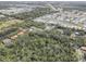 A stunning aerial view of this neighborhood shows a pond, easy highway access and lush, mature trees at 5104 2Nd E Ave, Palmetto, FL 34221