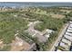Aerial view showing the residences, green landscaping, and community pool at 5104 2Nd E Ave, Palmetto, FL 34221