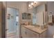 Light and bright bathroom with granite countertop and views to the living area at 5104 2Nd E Ave, Palmetto, FL 34221