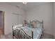 Bedroom with wood flooring, metal-frame bed, double closet and dresser at 5104 2Nd E Ave, Palmetto, FL 34221