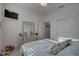 Bright bedroom featuring wood flooring, dresser with mirror, and a TV at 5104 2Nd E Ave, Palmetto, FL 34221
