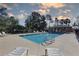 Community pool featuring lounge chairs and an open-air pavilion for relaxing at 5104 2Nd E Ave, Palmetto, FL 34221