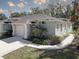 Lovely single-story home with an attached garage, manicured lawn, and lush landscaping at 5104 2Nd E Ave, Palmetto, FL 34221