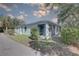 Light blue home exterior with screened patio and lush green landscaping at 5104 2Nd E Ave, Palmetto, FL 34221