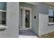 Welcoming front entrance with a glass door, 'welcome' mat, and sidelight window at 5104 2Nd E Ave, Palmetto, FL 34221