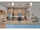 Modern kitchen with granite countertops, stainless steel appliances, and ample cabinet space at 5104 2Nd E Ave, Palmetto, FL 34221