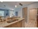 Open kitchen with stone countertops, a stainless steel sink, and seamless access to adjacent rooms at 5104 2Nd E Ave, Palmetto, FL 34221