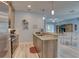 Open-concept kitchen with wood cabinets, granite countertops, and seamless access to the living area at 5104 2Nd E Ave, Palmetto, FL 34221