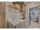 Well-lit laundry room with modern washer and dryer and convenient cabinets at 5104 2Nd E Ave, Palmetto, FL 34221