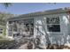 View of screened patio with ceiling fan at 5104 2Nd E Ave, Palmetto, FL 34221