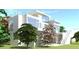 Contemporary house with a rooftop deck and many windows, surrounded by lush greenery at 511 Avonwood, Tampa, FL 33625