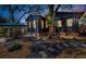 Well maintained backyard with rock and stone landscaping and patio seating area at 525 Lexington St, Dunedin, FL 34698