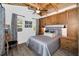Cozy bedroom features a comfortable bed, built-in storage, and soft lighting for a relaxing retreat at 525 Lexington St, Dunedin, FL 34698