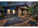 Charming bungalow with brick pathway, front porch, and well-lit facade at 525 Lexington St, Dunedin, FL 34698