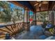 Spacious front porch with wicker furniture to sit and enjoy the Florida sunshine at 525 Lexington St, Dunedin, FL 34698