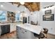 Bright kitchen with gray island, white cabinets, and stainless steel appliances at 525 Lexington St, Dunedin, FL 34698