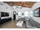 Inviting living room with vaulted ceilings, wood beams, and recessed lighting at 525 Lexington St, Dunedin, FL 34698