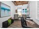 Bright office with vaulted ceilings, wood-look floors, and charming decor at 525 Lexington St, Dunedin, FL 34698