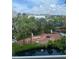Scenic aerial view of a lush community featuring a pond at 5500 Gulf Blvd # 4246, St Pete Beach, FL 33706