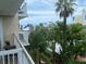 Balcony view overlooks lush greenery and the ocean at 5500 Gulf Blvd # 4246, St Pete Beach, FL 33706