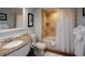 Cozy bathroom featuring a shower-tub combo, a granite vanity, and neutral wall color at 5500 Gulf Blvd # 4246, St Pete Beach, FL 33706