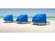 Sandy beach featuring tents for rent, providing shade and comfort by the water at 5500 Gulf Blvd # 4246, St Pete Beach, FL 33706