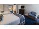 A cozy bedroom with a partial view of a kitchenette and attached bathroom at 5500 Gulf Blvd # 4246, St Pete Beach, FL 33706