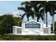 Welcoming entrance sign for Tradewinds Island Grand, surrounded by lush landscaping and palm trees at 5500 Gulf Blvd # 4246, St Pete Beach, FL 33706