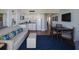 Comfortable living room with a sofa and adjacent kitchenette at 5500 Gulf Blvd # 4246, St Pete Beach, FL 33706