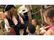 A pirate is sharing a tale with children on a dock at 5500 Gulf Blvd # 4246, St Pete Beach, FL 33706