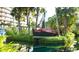 Unique pirate ship on the grounds, adding nautical charm to the lush landscape at 5500 Gulf Blvd # 4246, St Pete Beach, FL 33706