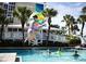 Fun filled pool with a water slide and enjoying a jump into the refreshing water at 5500 Gulf Blvd # 4246, St Pete Beach, FL 33706