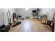 Finished basement music room featuring guitars, musical instruments, and wood-look floors at 601 Gay Rd, Seffner, FL 33584