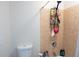 Shower space with tiled walls, a toilet, and storage shelves with bath and body products at 601 Gay Rd, Seffner, FL 33584