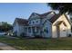 Beautiful two-story home showcases a covered front porch, mature landscaping, and an inviting facade, ensuring curb appeal at 601 Gay Rd, Seffner, FL 33584