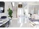 Spacious foyer features high ceilings, tile floors, staircase, and views into the living spaces at 601 Gay Rd, Seffner, FL 33584