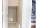 View of a hallway niche with decor and a stairwell featuring wrought iron banisters and wood treads at 601 Gay Rd, Seffner, FL 33584