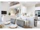 Open-concept layout showcasing kitchen with island, counter seating, and modern finishes that integrate seamlessly with the living area at 601 Gay Rd, Seffner, FL 33584