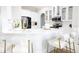 Modern kitchen featuring stainless appliances, white cabinets, and pendant lighting at 601 Gay Rd, Seffner, FL 33584