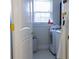 Bright laundry room with a washer and dryer, lots of counter space, and a window at 601 Gay Rd, Seffner, FL 33584