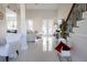 Bright living room featuring neutral decor, a staircase, and sleek tile flooring at 601 Gay Rd, Seffner, FL 33584
